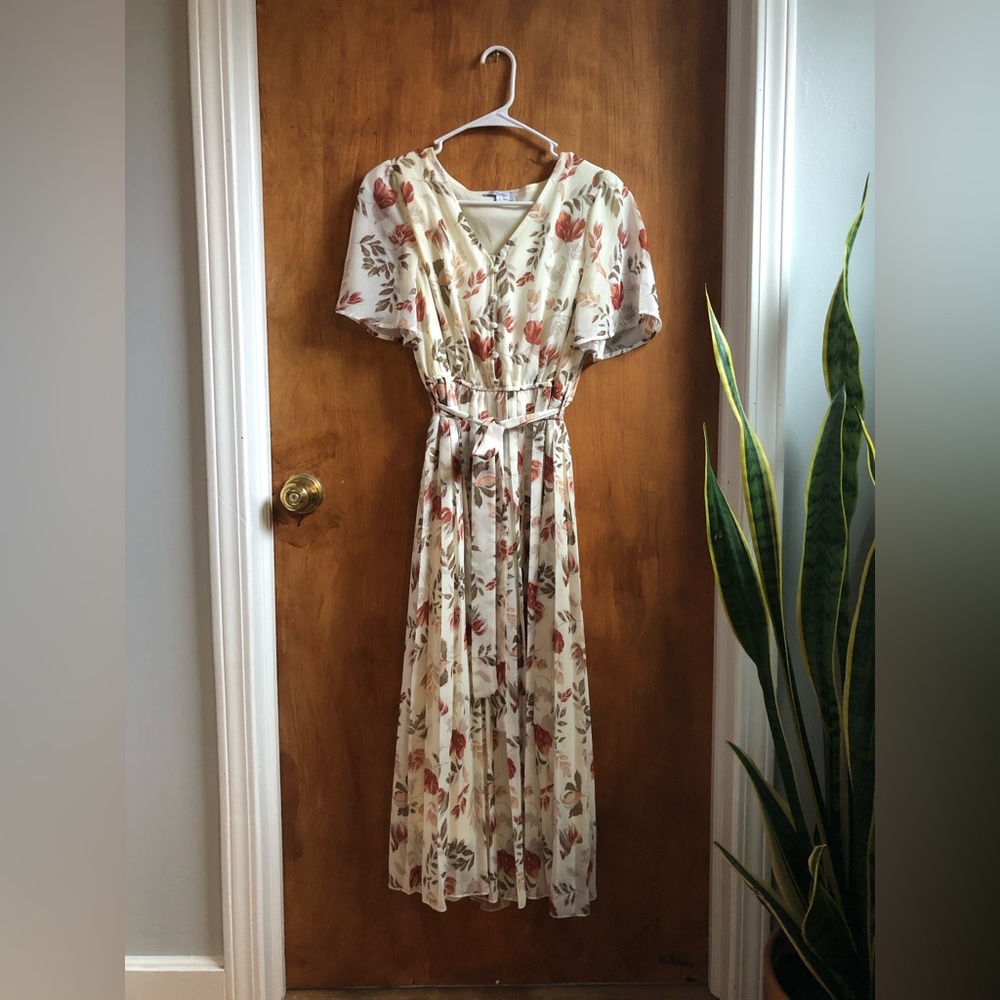 Long, flowing maxi dress. Ivory color with flowers, medium.